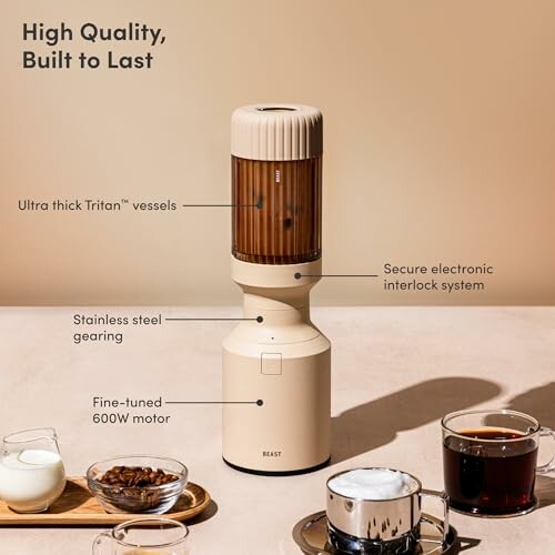 Beast blender with drinks and labeled features including Tritan vessels, electronic interlock, stainless steel gearing, and 600W motor.