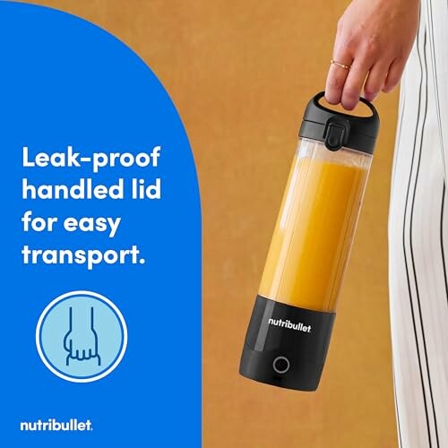 Person holding a Nutribullet bottle with leak-proof lid.