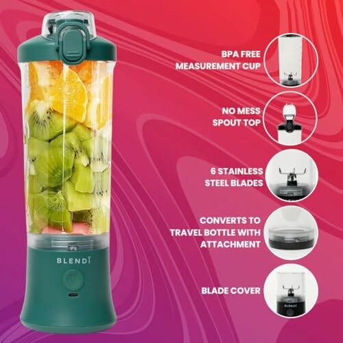 Portable blender with colorful fruits inside on a red background.