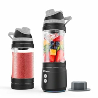Portable blender with fruits and smoothie.