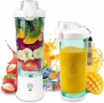 Portable blender with fruit and smoothie ingredients.