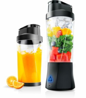 Two portable blenders, one with orange juice and the other with fruits and ice.